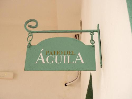 a green sign that reads patron del acula at Bhost - Palacete del Águila in Córdoba
