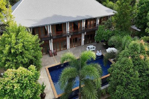 an aerial view of a house with a swimming pool at SS pool villa hills in Ban Tao Than