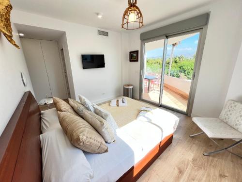 Postel nebo postele na pokoji v ubytování PUSHE Playa Granada Beach&Golf 4