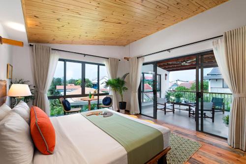 Postel nebo postele na pokoji v ubytování Oriental Botanica Estate Vesta Collections