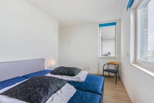Ένα ή περισσότερα κρεβάτια σε δωμάτιο στο Hello Zeeland - Appartement Port Scaldis 03-071