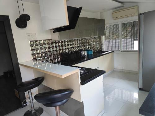 Una cocina o zona de cocina en GrnStay