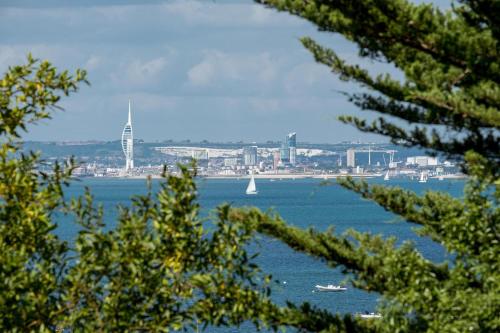 a view of a large body of water with a sail boat at Shellharbour in Seaview