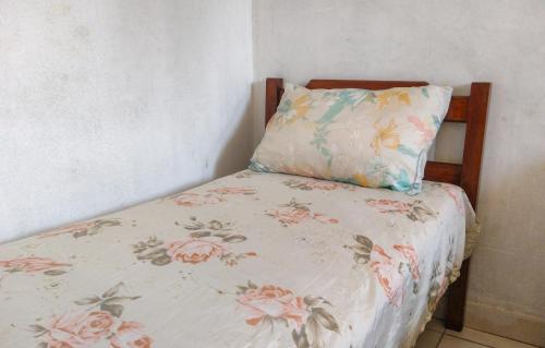 Ένα ή περισσότερα κρεβάτια σε δωμάτιο στο Hostel Residence Girassol