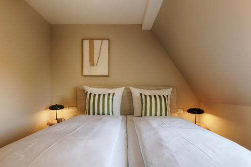 a bedroom with two beds in a attic at Hotel Fischzucht in Würzburg in Würzburg
