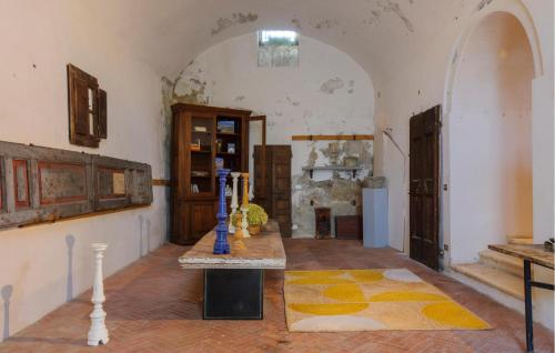 a room with a table in the middle of a room at Stunning Home In Macerata Feltria in Macerata Feltria