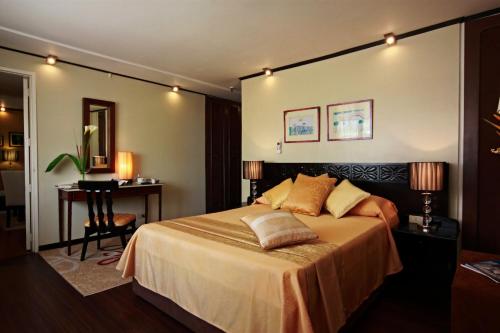 Voodi või voodid majutusasutuse Manila Manor Hotel toas