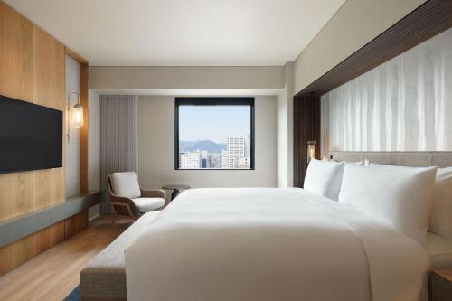 Ein Bett oder Betten in einem Zimmer der Unterkunft Courtyard by Marriott Sapporo