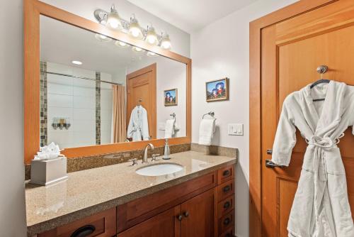 a bathroom with a sink and a large mirror at Maroon Point Capitol Peak Lodge #3516 in Snowmass Village