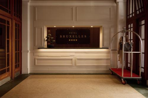 a room with a wall with a sign on it at Hotel Bruxelles in Cape Town