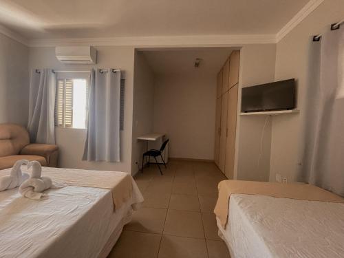 Ένα ή περισσότερα κρεβάτια σε δωμάτιο στο Big Hotel