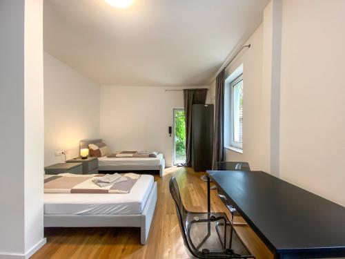 Ένα ή περισσότερα κρεβάτια σε δωμάτιο στο G&G Apartments