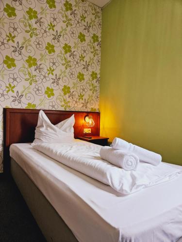 Postel nebo postele na pokoji v ubytování IKURA Hotel Self-check-in