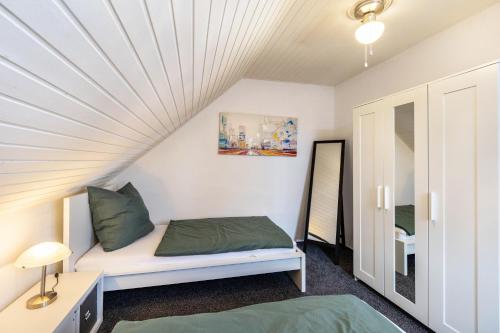 a small room with a bed and a window at Lichtblick in Bottrop