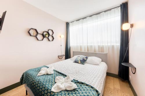 Katil atau katil-katil dalam bilik di Appartement spacieux, Paris centre 20min, Orly 20min, Disney 35min