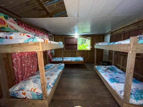 Postel nebo postele na pokoji v ubytování Wira Pora Hostal