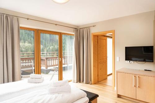 Ένα ή περισσότερα κρεβάτια σε δωμάτιο στο Gerlos Alpine Estate - Gerlos