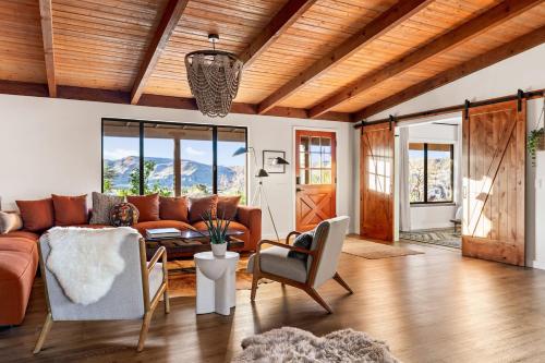 a living room with a couch and a table at The Raven By The Cohost Company in Pioneertown