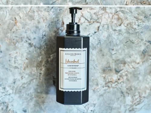 a black soap bottle sitting on top of a counter at Thank You Hotel Sultanahmet in Istanbul