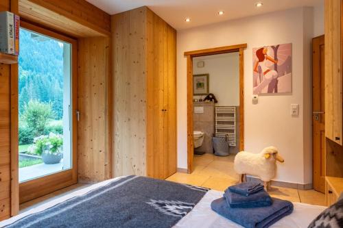 Ένα ή περισσότερα κρεβάτια σε δωμάτιο στο Chalet le 4 - numéro 1