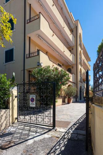 a gate in front of a building at Residence Vigna del Mare in Gabicce Mare
