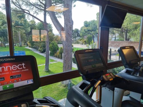 a view from the front of a bus with a view of a tree at Hotel Boutique Mirasierra in Villacañas