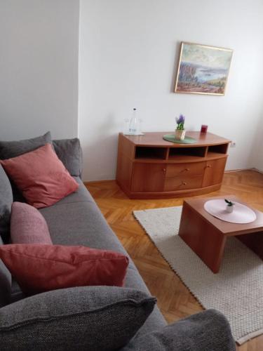 a living room with a couch and a table at Hotel Vlasina - Vlasinsko jezero in Lujinska Mala