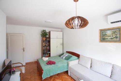 a living room with a couch and a table at Apartment Lea in Belgrade