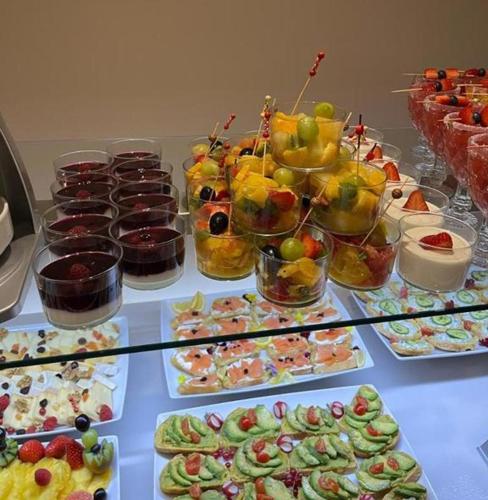 a buffet filled with different types of food on a table at Hotel BH San Francisco Alicante in Alicante