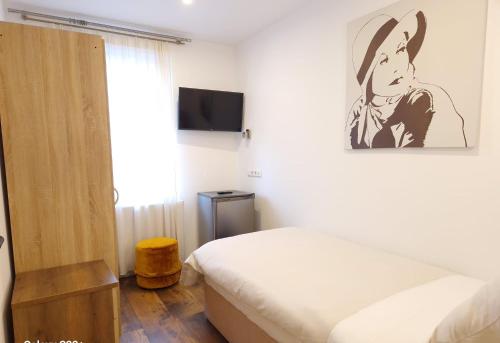 Postel nebo postele na pokoji v ubytování Hotel Post Nürtingen