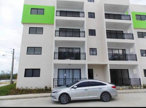 a car parked in front of a building at Cañaveral Del Mar 1 Quiet and extremally relaxing! in San Felipe de Puerto Plata