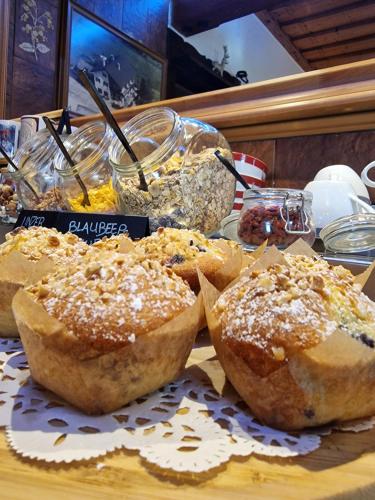 a table with three pastries on a table at Rosy's House B&B in Bad Goisern