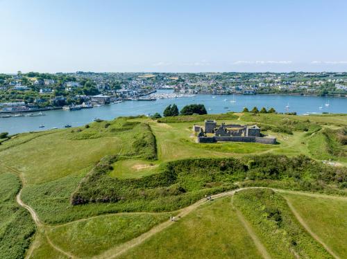 an aerial view of a house on a hill next to a river at Trident Hotel Kinsale in Kinsale