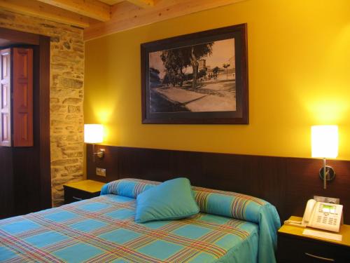 Postel nebo postele na pokoji v ubytování Hotel Rolle