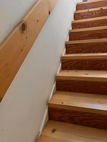 a stairway with wooden stairs in a house at Villa Aurea in Ispica