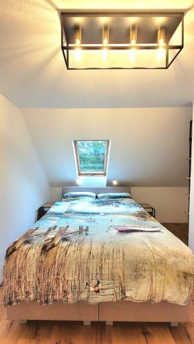 a bedroom with a large bed with lights on it at Heimatliebe Neuried 20 Min zum Europa-Park in Neuried