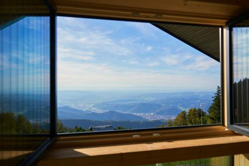 a window view of a valley from a mountain at Bergwelt Kandel Hotel & Eventlocation in Waldkirch