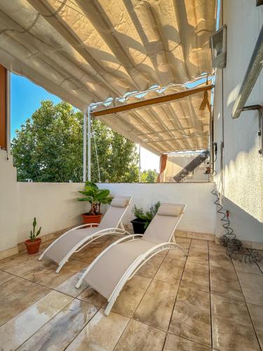 Charming 2 Bedroom Boutique Triplex Apartment with Private Terrace at Seville City Center by OCityzen