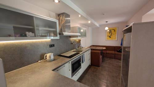 a kitchen with a sink and a counter top at Taikos 7 in Nida