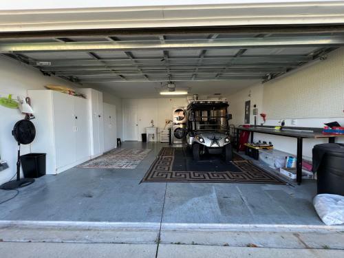 a garage with a ping pong table in it at Delia Place Florida Oasis With Private Lanai in The Villages