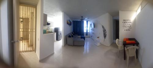 a hallway with a kitchen and a living room at Apartamento Amoblado Cartagena in Cartagena de Indias