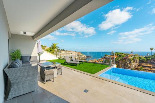 a view of the ocean from the patio of a house at JPL Blue Horizon Residential - Casa Horizon A in Câmara de Lobos