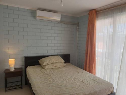 Ένα ή περισσότερα κρεβάτια σε δωμάτιο στο Townhouse in Liloan, Cebu