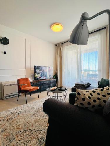 a living room with a couch and a chair at Apt Ljupka - Zadar - with private free parking in Zadar