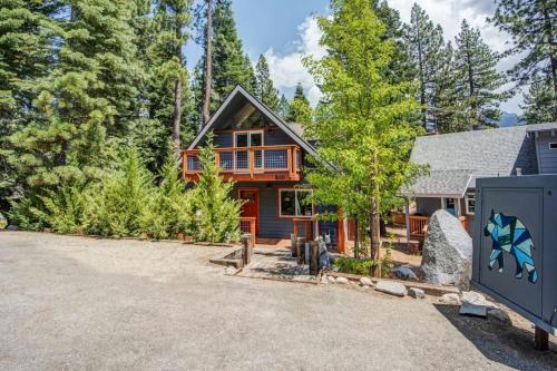 a home in the woods with a driveway at Hot tub - Play structure - Mini pool table game in South Lake Tahoe