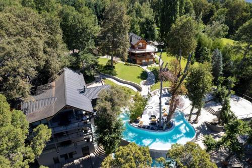 an aerial view of a resort with a swimming pool at Rotui Luxury Village in San Martín de los Andes