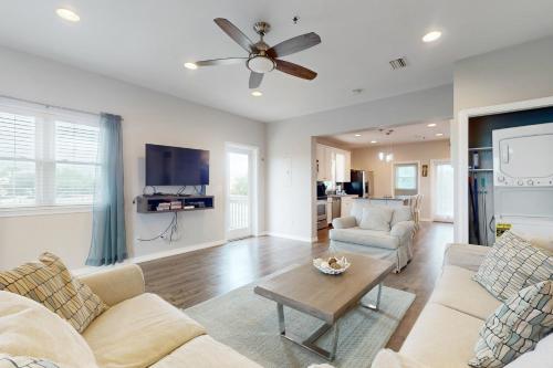 a living room with a couch and a table at Sharp Reef on the Gulf #5 in Pensacola