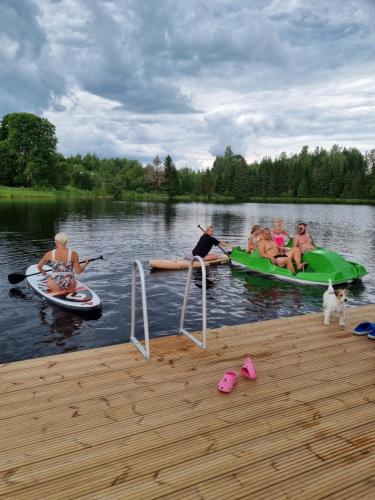 a group of people on kayaks on a lake at Ala Sarise saunamaja in Sarise