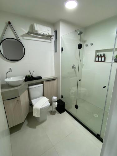 a bathroom with a shower and a toilet and a sink at RN STUDIO PREMIUM Ap 321 in Maceió