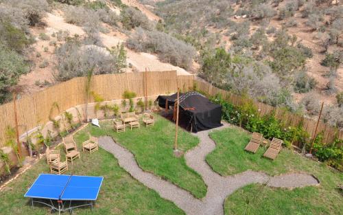 an aerial view of a backyard with a table and chairs at harmony surf lodge in Taghazout